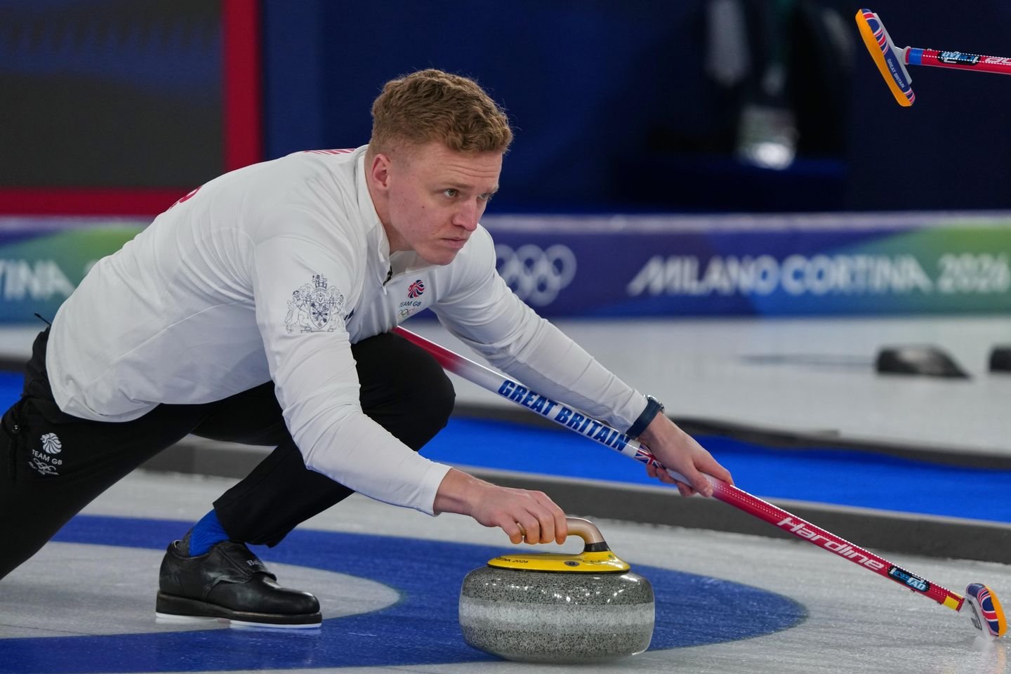 What is curling, and what is the controversy surrounding it at the Winter Olympics?